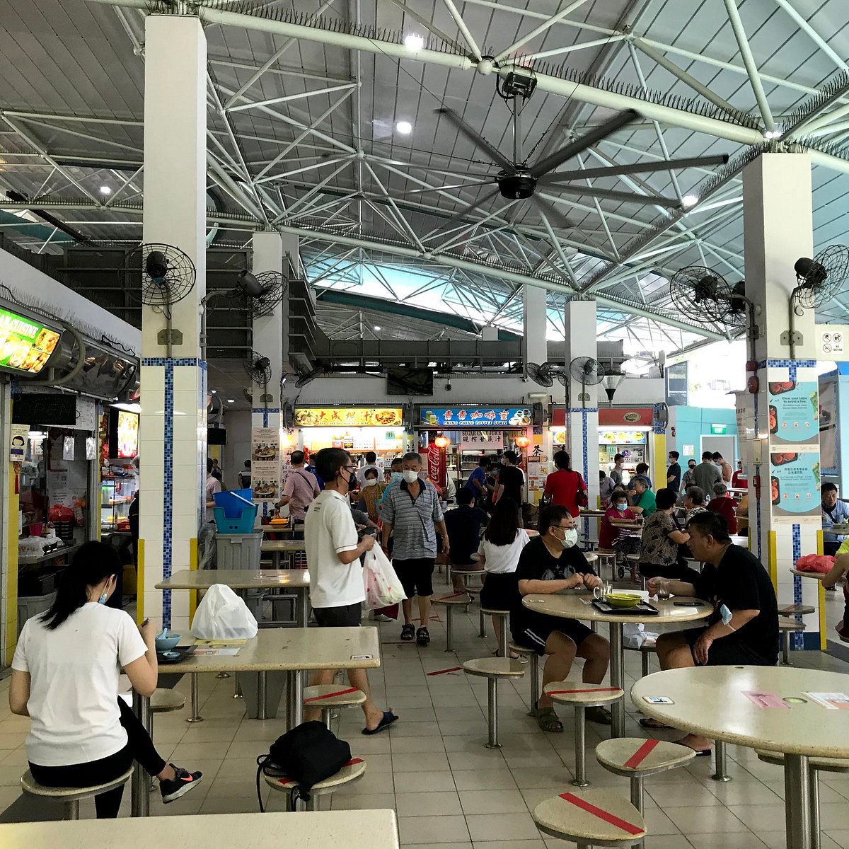 Residents eating at the Lorong 1 Toa Payoh hawker centre